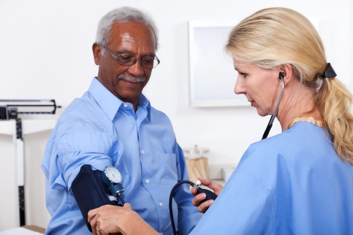 a nurse taking blood pressure