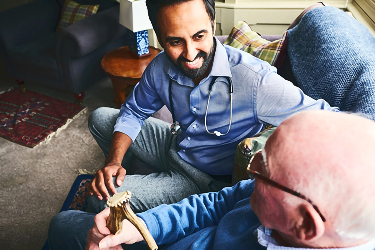 a doctor doing a home visit